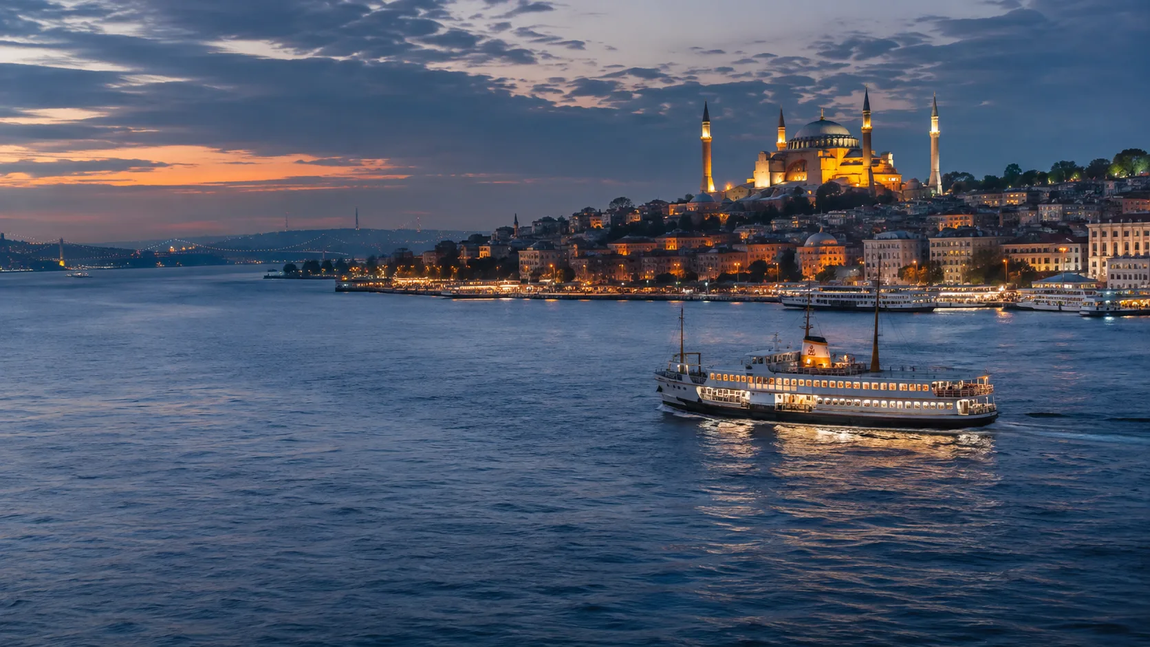 Istanbul waterfront and a ferry at dusk
